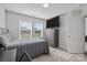 Bedroom features a bed with gray bedding, a dresser with a TV and a single window with lots of natural light at 235 Boxelder Rd, Clover, SC 29710