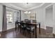 Elegant dining room features hardwood floors, a chandelier, and large windows for natural light at 235 Boxelder Rd, Clover, SC 29710