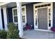 Inviting front entrance with a stylish door, sidelights, and decorative landscaping enhancing curb appeal at 235 Boxelder Rd, Clover, SC 29710