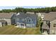 Two-story blue house with an outdoor patio, backyard, and dark grey roof at 235 Boxelder Rd, Clover, SC 29710