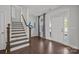 Bright foyer with hardwood floors, staircase, and a view of the front door and ample natural light at 235 Boxelder Rd, Clover, SC 29710