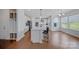 Open-concept kitchen with hardwood floors, an island with barstools, and stainless steel appliances at 235 Boxelder Rd, Clover, SC 29710