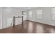 Upstairs landing with hardwood floors and natural light from two windows at 235 Boxelder Rd, Clover, SC 29710