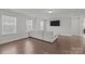 Sunlit living room with hardwood floors and a comfortable white sofa at 235 Boxelder Rd, Clover, SC 29710