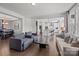 Open concept living room with view of kitchen, hardwood flooring, and modern gray furniture at 235 Boxelder Rd, Clover, SC 29710