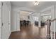 Open-concept living space with hardwood floors, dining area, and seamless transition to the kitchen at 235 Boxelder Rd, Clover, SC 29710