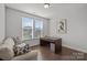 Comfortable office space with large windows, a desk, and a cozy sofa at 235 Boxelder Rd, Clover, SC 29710