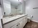 Bathroom featuring double vanity, granite countertop, and tub and shower combo at 2609 Lamp Post Ln, Kannapolis, NC 28081