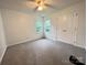 Cozy bedroom with carpeted floors, ceiling fan and double door closet at 2609 Lamp Post Ln, Kannapolis, NC 28081