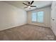 Bedroom featuring carpeted floors, ceiling fan, and natural light at 2609 Lamp Post Ln, Kannapolis, NC 28081
