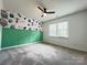 Bedroom with a ceiling fan, carpeted floors, and playful decor at 2609 Lamp Post Ln, Kannapolis, NC 28081