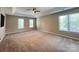 Spacious bedroom with ceiling fan and multiple windows at 2609 Lamp Post Ln, Kannapolis, NC 28081