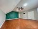Open bonus room with hardwood floors, ceiling fan, and ample space at 2609 Lamp Post Ln, Kannapolis, NC 28081