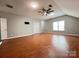 Spacious bonus room with hardwood floors and ceiling fan at 2609 Lamp Post Ln, Kannapolis, NC 28081