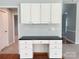 Home office nook featuring built-in desk with drawers and overhead cabinets at 2609 Lamp Post Ln, Kannapolis, NC 28081