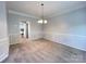 Dining room featuring chair rail, chandelier, and neutral color palette at 2609 Lamp Post Ln, Kannapolis, NC 28081