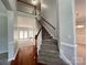 Bright foyer with hardwood floors, carpeted stairs, and open view into living spaces at 2609 Lamp Post Ln, Kannapolis, NC 28081