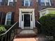 Welcoming front entrance with a black door, white trim, and decorative flower planters at 2609 Lamp Post Ln, Kannapolis, NC 28081