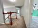 Carpeted hallway with access to the second-floor bedrooms at 2609 Lamp Post Ln, Kannapolis, NC 28081