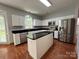 Spacious kitchen with a center island, stainless appliances, and white cabinetry at 2609 Lamp Post Ln, Kannapolis, NC 28081