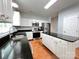 Well-equipped kitchen with stainless steel appliances, island, and sleek black countertops at 2609 Lamp Post Ln, Kannapolis, NC 28081