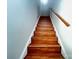A stairway with wood treads and white risers leads upwards, complemented by a light wood handrail at 2609 Lamp Post Ln, Kannapolis, NC 28081