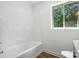 Bathroom features a tub, and a window with a view of the surrounding landscape at 2705 Lowell Bethesda Rd, Gastonia, NC 28056