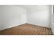 Bedroom with plank flooring and a window offering natural light at 2705 Lowell Bethesda Rd, Gastonia, NC 28056