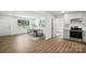 Open-concept dining area next to kitchen with plenty of natural light and stylish decor at 2705 Lowell Bethesda Rd, Gastonia, NC 28056