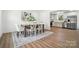 Inviting dining area adjacent to the kitchen features a modern table, area rug, and natural light at 2705 Lowell Bethesda Rd, Gastonia, NC 28056