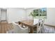Sunny dining room with modern table, comfortable chairs, and large window at 2705 Lowell Bethesda Rd, Gastonia, NC 28056
