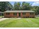 Charming brick home with a well-manicured lawn and mature trees, offering great curb appeal at 2705 Lowell Bethesda Rd, Gastonia, NC 28056