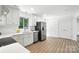 Modern kitchen with white cabinets, stainless steel appliances, and plenty of counter space at 2705 Lowell Bethesda Rd, Gastonia, NC 28056