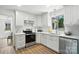 Bright kitchen with white cabinets, stainless steel appliances, and a view from the window at 2705 Lowell Bethesda Rd, Gastonia, NC 28056