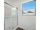 Modern bathroom shower featuring a glass enclosure and a bright window at 2705 Lowell Bethesda Rd, Gastonia, NC 28056