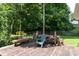 Relaxing backyard deck with a wooded view, seating, and a rustic woodpile at 2825 Edwin Jones Dr, Charlotte, NC 28269