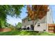 View of a backyard with a patio, outdoor seating, and mature trees at 3109 Buckleigh Dr, Charlotte, NC 28215