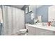 Cozy bathroom with blue walls and a shower featuring a butterfly curtain at 3109 Buckleigh Dr, Charlotte, NC 28215
