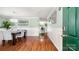 Elegant dining area with hardwood floors and stylish chandelier is visible from the doorway at 3109 Buckleigh Dr, Charlotte, NC 28215