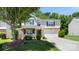 Charming two-story home featuring stone accents, green shutters, well-maintained landscaping, and a two-car garage at 3109 Buckleigh Dr, Charlotte, NC 28215
