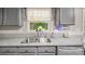 Close-up of a kitchen sink with a window and stainless steel faucet at 3109 Buckleigh Dr, Charlotte, NC 28215