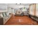 Spacious living room with hardwood floors seamlessly flows into kitchen area at 3109 Buckleigh Dr, Charlotte, NC 28215