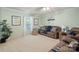 The spacious living room features plush carpeting, a ceiling fan, and plenty of natural light at 3109 Buckleigh Dr, Charlotte, NC 28215