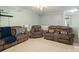 This living room features carpeting and plenty of comfortable seating for entertaining guests at 3109 Buckleigh Dr, Charlotte, NC 28215