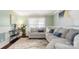 Cozy living room featuring a large sectional couch and decorative accents at 3109 Buckleigh Dr, Charlotte, NC 28215