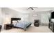 Spacious bedroom with ceiling fan, carpeted floor, and lots of natural light at 3109 Buckleigh Dr, Charlotte, NC 28215