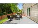 Backyard patio space with outdoor seating, a fire pit, and a privacy fence at 3109 Buckleigh Dr, Charlotte, NC 28215