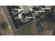 Aerial view of the property showcasing its layout, boundaries, and proximity to local roads at 323 Wendover Dr, Locust, NC 28097