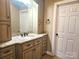 Bathroom featuring a granite vanity with double sinks and white cabinets at 323 Wendover Dr, Locust, NC 28097