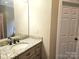 Bathroom vanity featuring granite countertops and stainless steel fixtures at 323 Wendover Dr, Locust, NC 28097